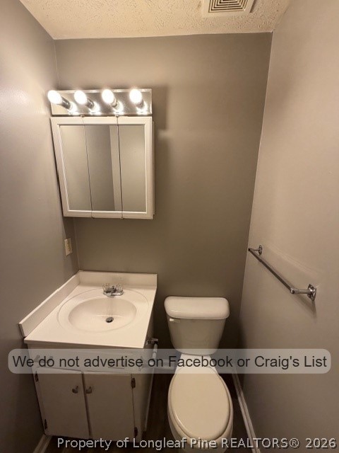 6211 Rannock Drive Fayetteville, NC 28304 - Photo 5 of 9 a bathroom with a granite countertop toilet sink and mirror
