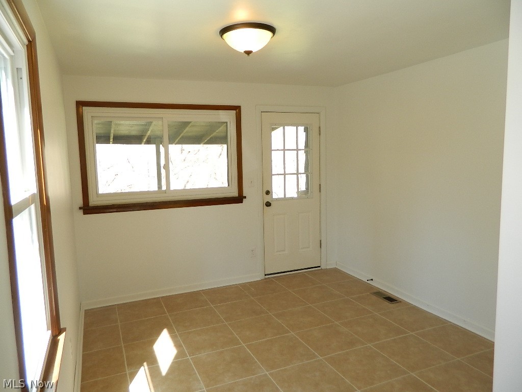9772 Chardon Road Chardon, OH 44024 - Photo 13 of 35 Formal Dining Room - The Door You See is the Door You Would Enter From Going and Coming to the Garages.