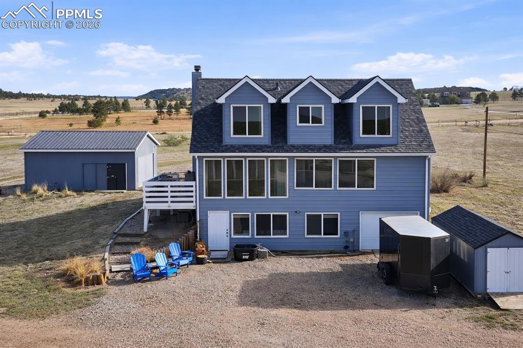 12285 Old Barn Road Elbert, CO 80106 - Photo 3 of 39 a front view of a house with a yard