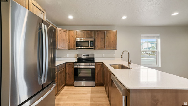 1223 East 1775 North Payson, UT 84651 - Photo 26 of 45 Kitchen featuring wood-finish cabinetry, stainless steel appliances, and light-toned countertops