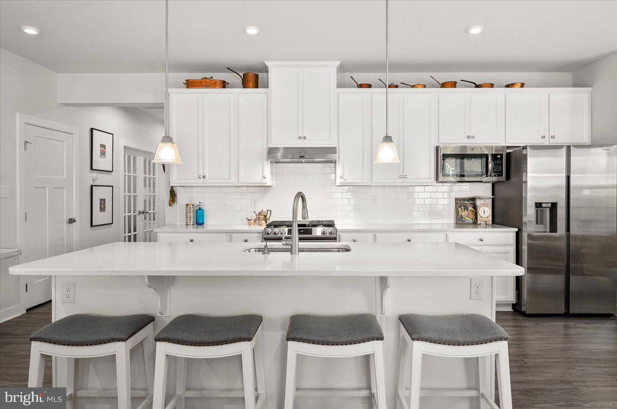 65 Old Forge Drive Ocean View, DE 19970 - Photo 13 of 69 a kitchen with cabinets and chairs