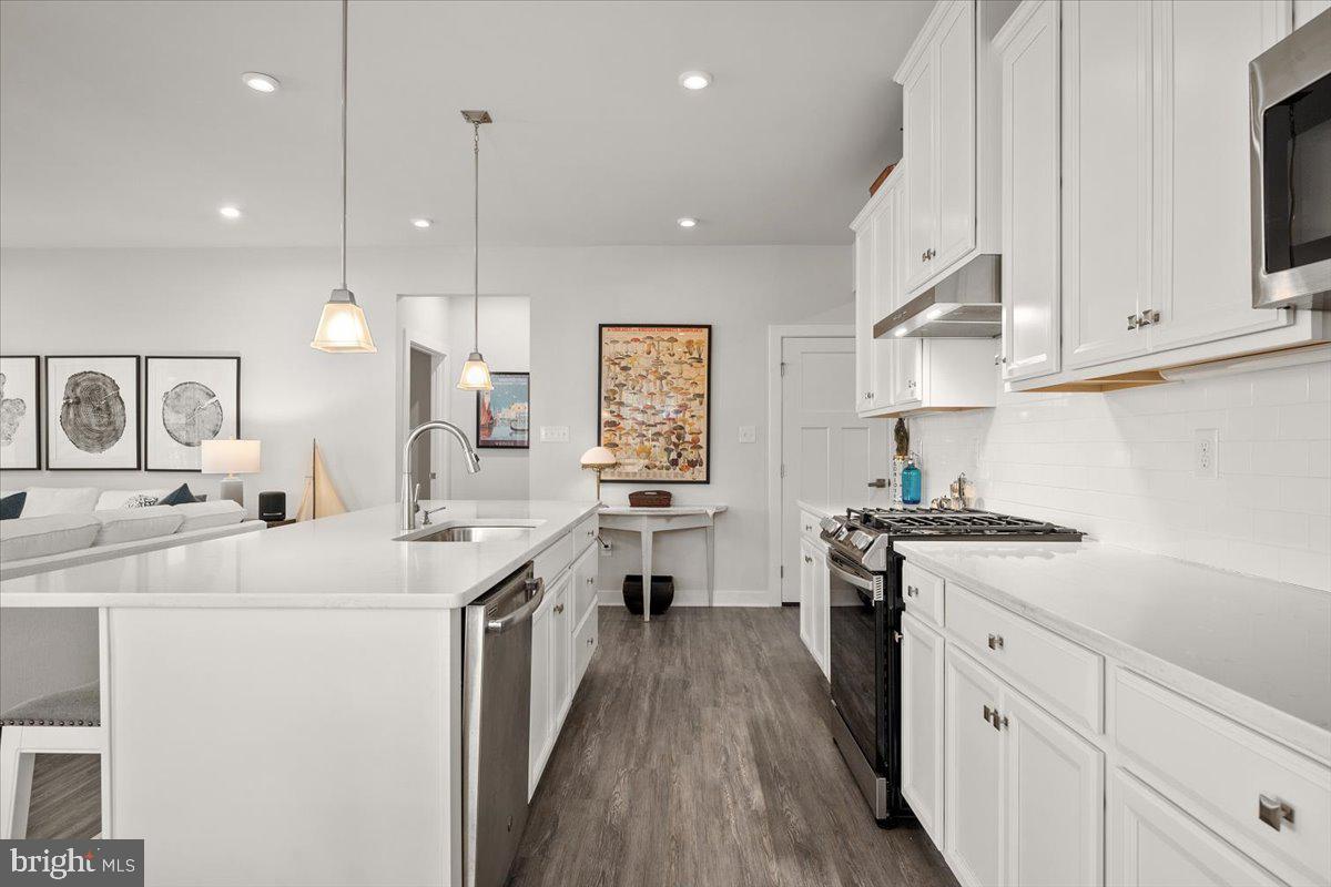 65 Old Forge Drive Ocean View, DE 19970 - Photo 15 of 69 a kitchen with white cabinets sink and stove