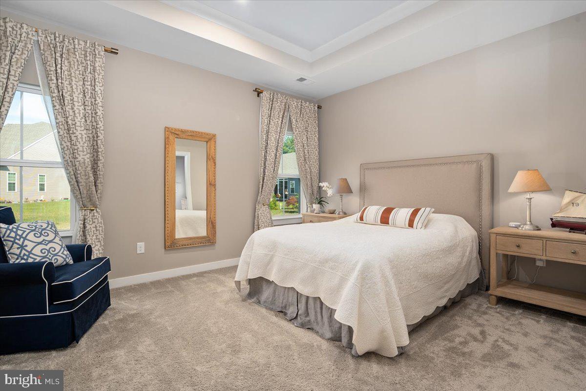 65 Old Forge Drive Ocean View, DE 19970 - Photo 20 of 69 a bedroom with a bed and wooden floor