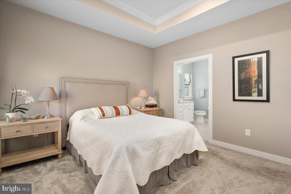 65 Old Forge Drive Ocean View, DE 19970 - Photo 22 of 69 a bedroom with bed and a night stand