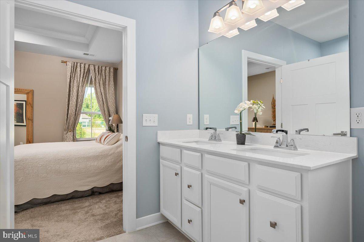 65 Old Forge Drive Ocean View, DE 19970 - Photo 26 of 69 a en suite bathroom with 2 sink and a mirror