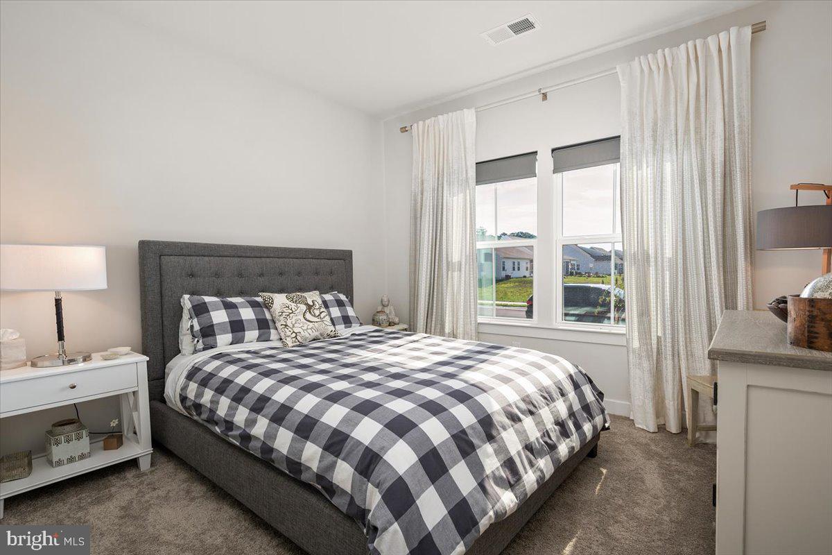 65 Old Forge Drive Ocean View, DE 19970 - Photo 34 of 69 a bedroom with a bed and a window