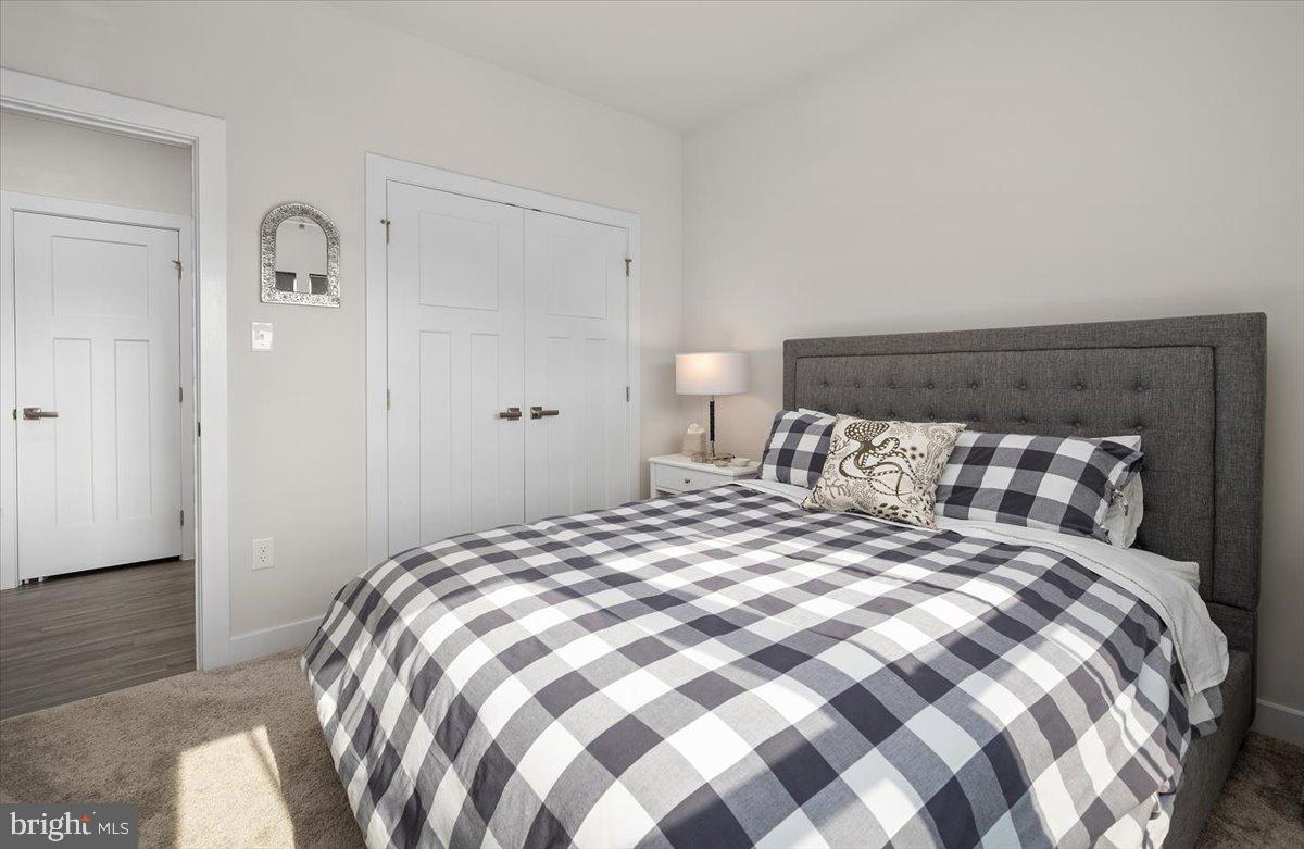 65 Old Forge Drive Ocean View, DE 19970 - Photo 36 of 69 a bedroom with a bed and wooden floor