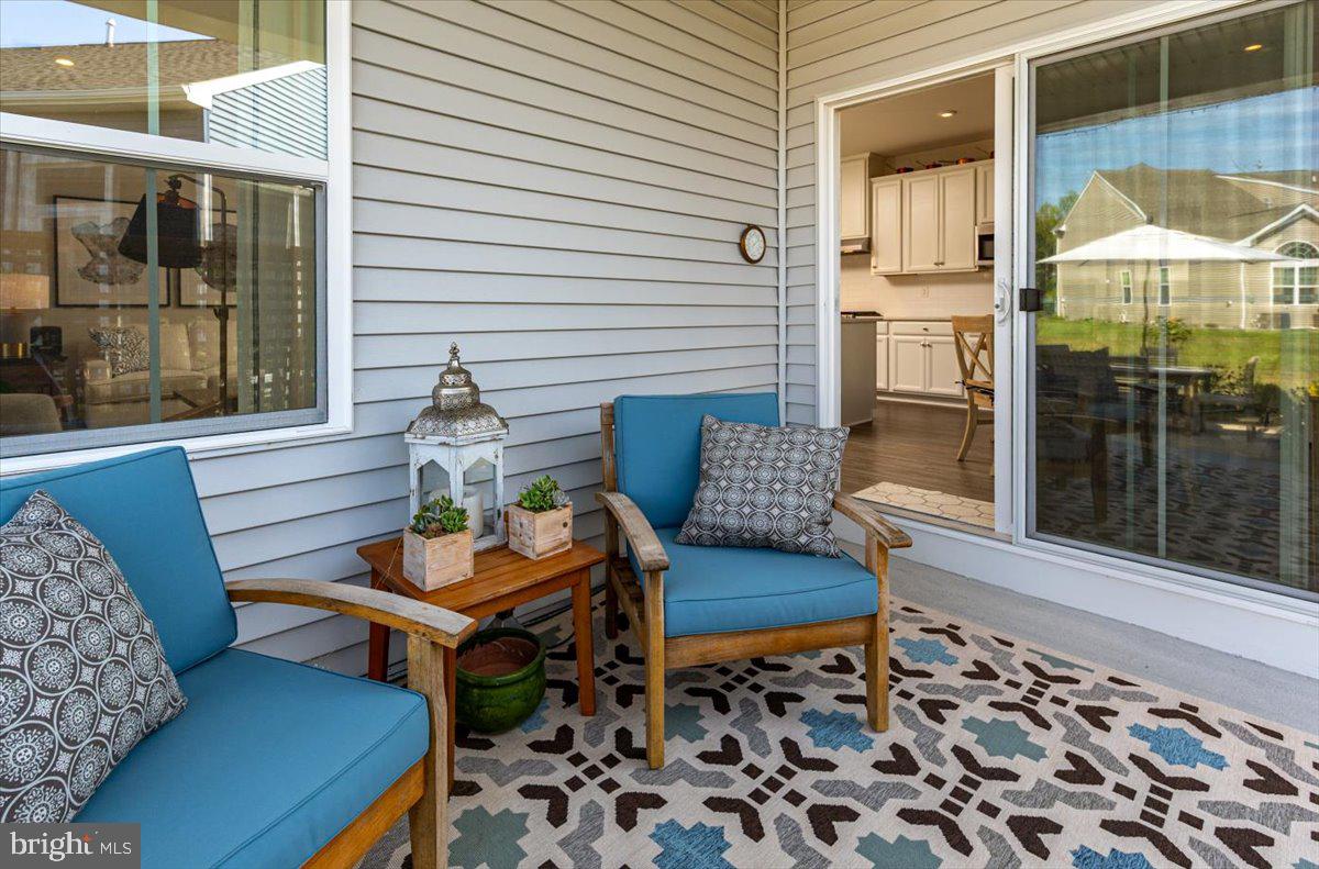 65 Old Forge Drive Ocean View, DE 19970 - Photo 39 of 69 a outdoor living space with furniture and a rug