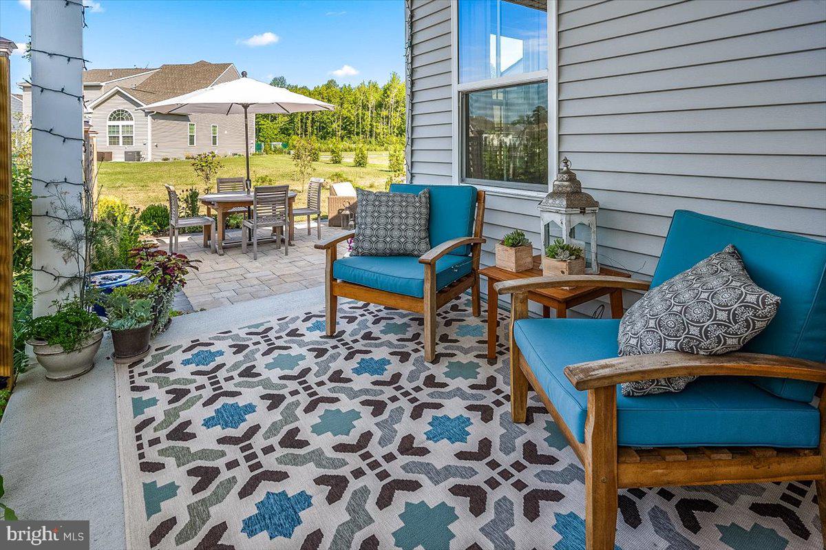 65 Old Forge Drive Ocean View, DE 19970 - Photo 40 of 69 a outdoor space with patio the couches and a potted plant on a table
