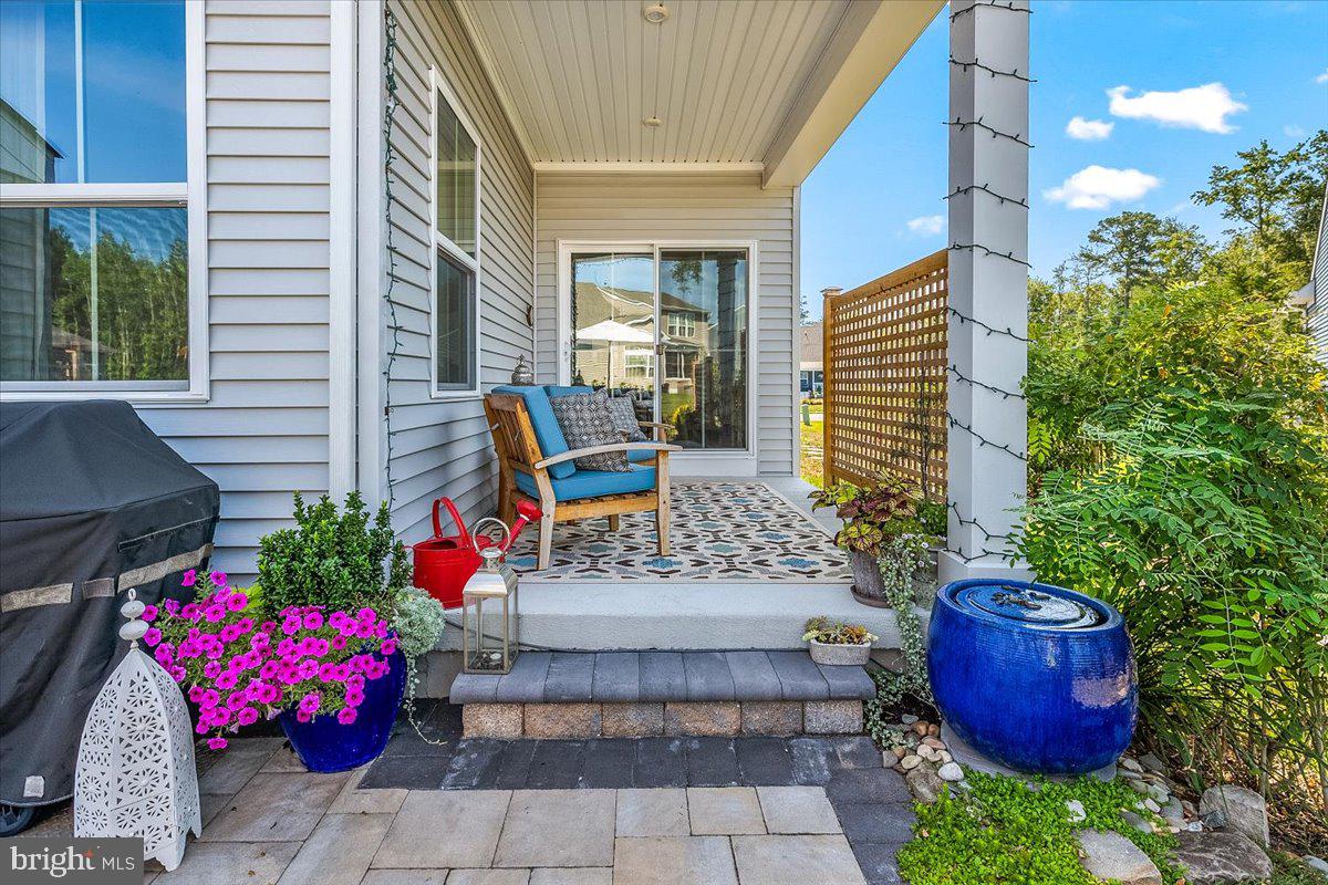 65 Old Forge Drive Ocean View, DE 19970 - Photo 42 of 69 a view of a patio with chairs and potted plants