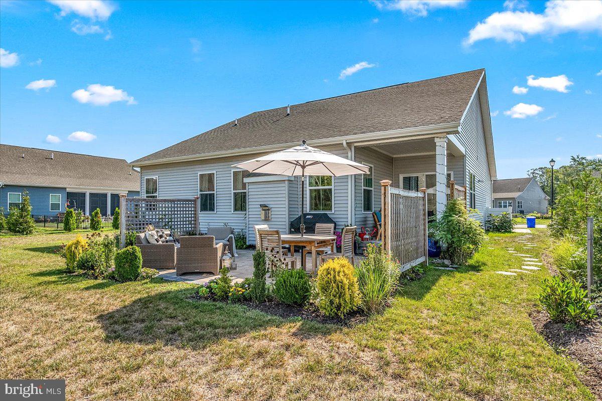 65 Old Forge Drive Ocean View, DE 19970 - Photo 48 of 69 a view of a house with backyard sitting area and garden