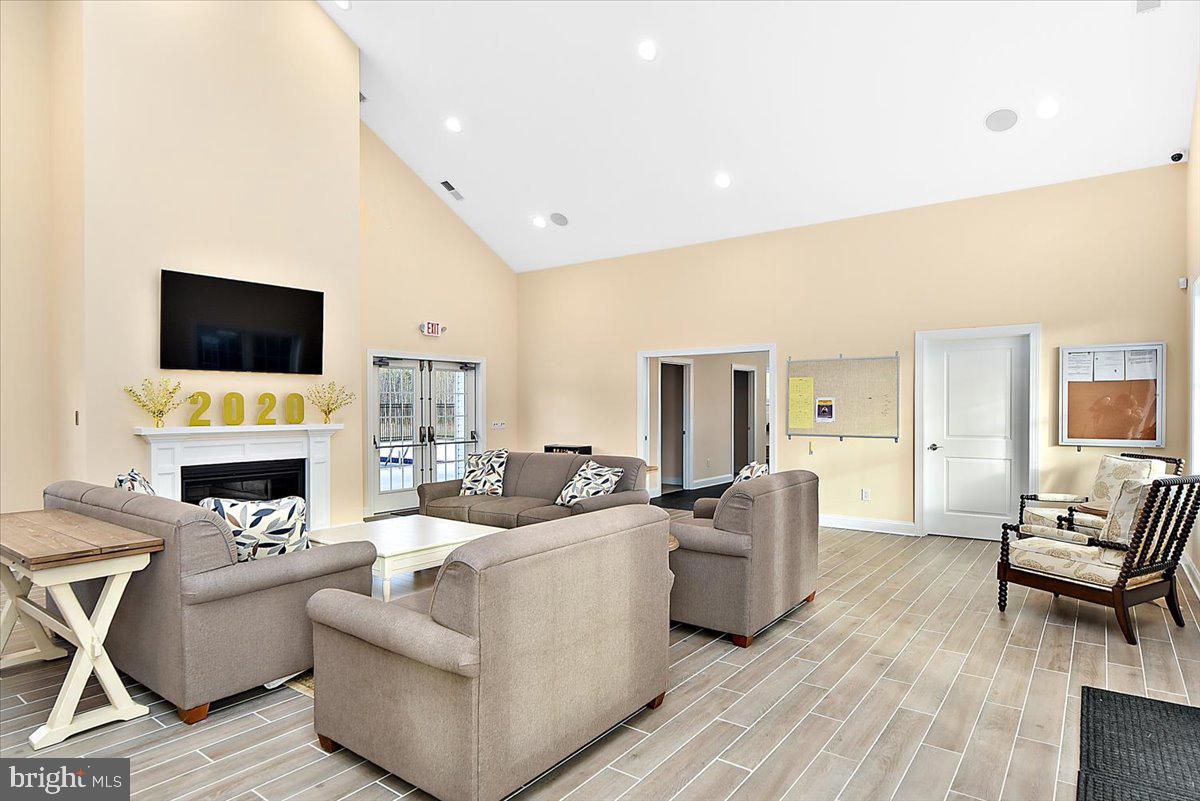 65 Old Forge Drive Ocean View, DE 19970 - Photo 68 of 69 a living room with fireplace furniture and a flat screen tv