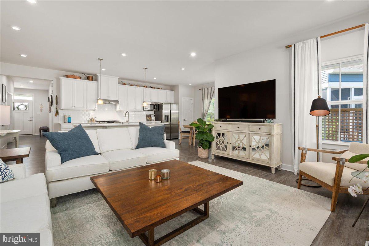 65 Old Forge Drive Ocean View, DE 19970 - Photo 9 of 69 a living room with furniture and a flat screen tv