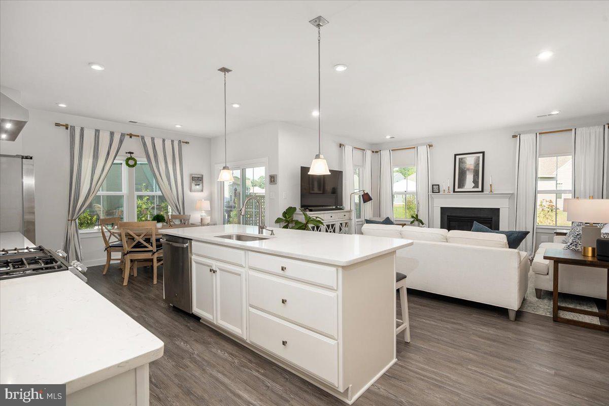 65 Old Forge Drive Ocean View, DE 19970 - Photo 10 of 69 a kitchen with a sink stove and cabinets