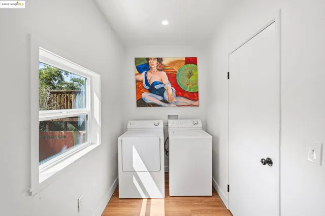 a room with a door and a painting on the wall