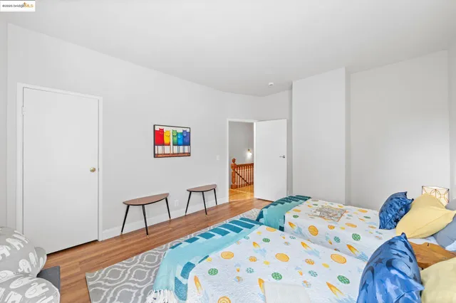 a bedroom with a bed and a table in it