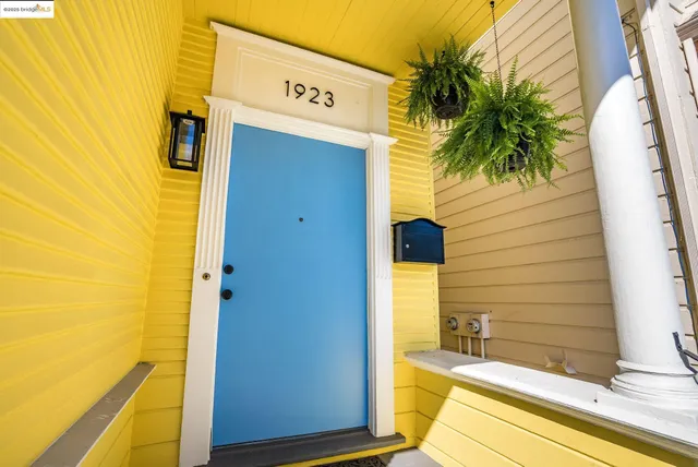 a yellow house with a outdoor space