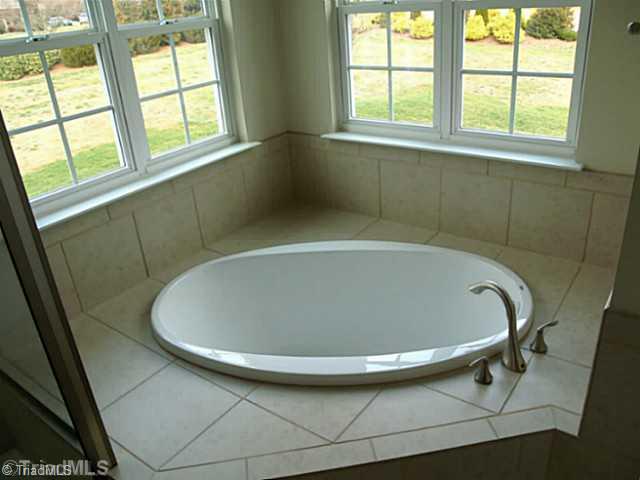 6624 Stonecroft Drive Oak Ridge, NC 27310 - Photo 12 of 16 Master Bath/Spa. Tile Surround