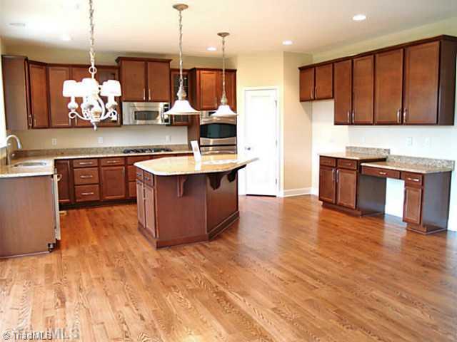 6624 Stonecroft Drive Oak Ridge, NC 27310 - Photo 8 of 16 Kitchen. Hardwood Throughout