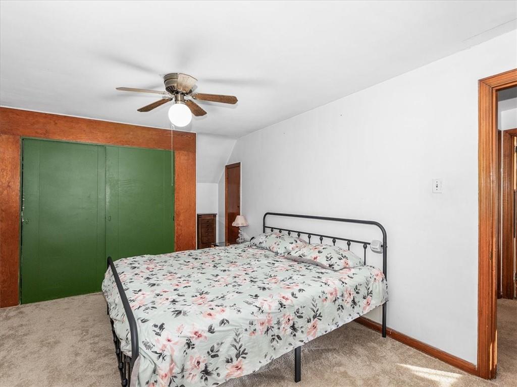 185 Highway 68 Rochester, PA 15074 - Photo 15 of 29 a bedroom with a bed and a chandelier