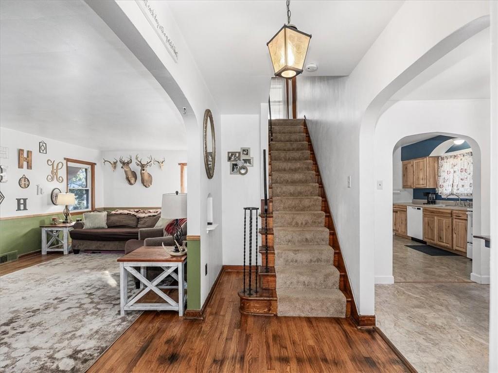 185 Highway 68 Rochester, PA 15074 - Photo 2 of 29 a view of a livingroom with furniture wooden floor windows and staircase