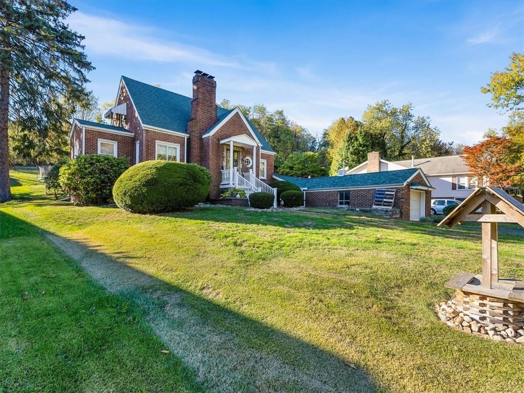 185 Highway 68 Rochester, PA 15074 - Photo 27 of 29 a front view of a house with garden