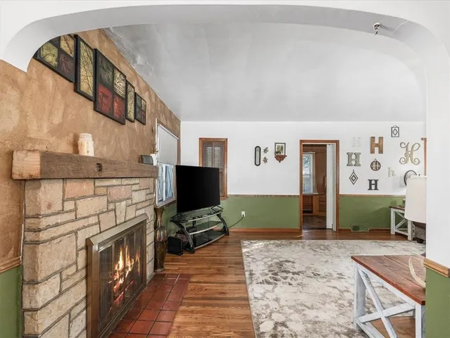 a view of a livingroom with furniture and a flat screen tv