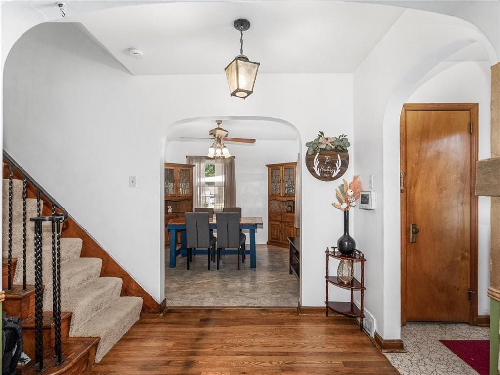 185 Highway 68 Rochester, PA 15074 - Photo 9 of 29 a view of a dining room with furniture wooden floor and a chandelier
