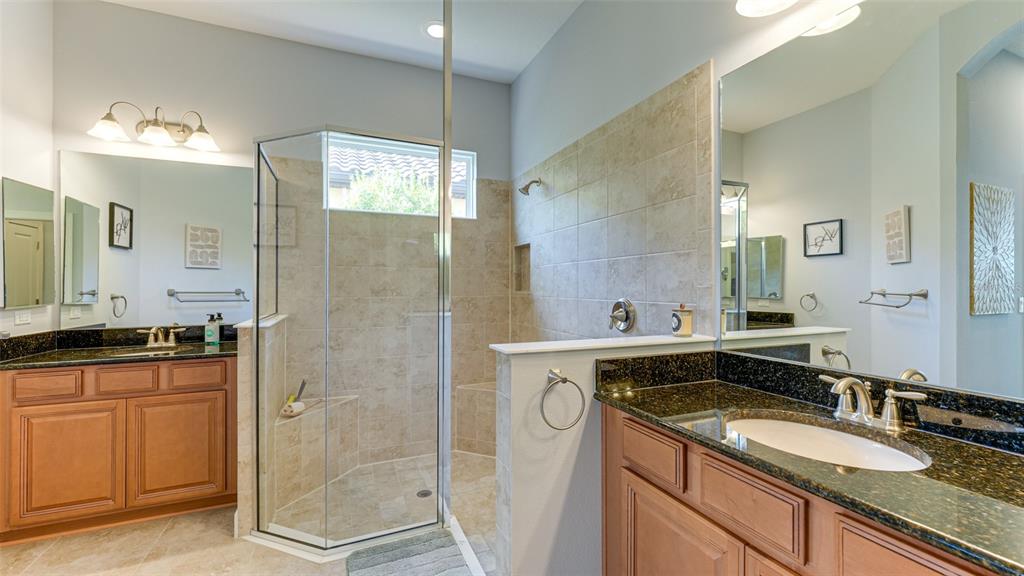 4511 Terrazza Court Lakewood Ranch, FL 34211 - Photo 18 of 65 a bathroom with a granite countertop sink mirror and double