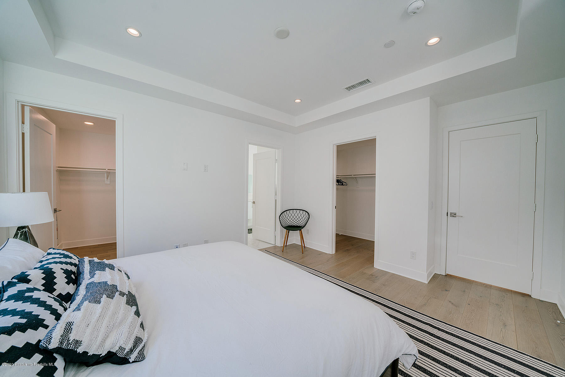 855 Hyperion Avenue Los Angeles, CA 90029 - Photo 12 of 35 a bedroom with a bed and a mirror
