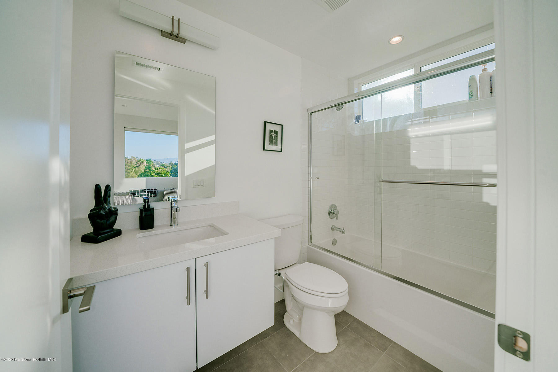855 Hyperion Avenue Los Angeles, CA 90029 - Photo 20 of 35 a bathroom with a sink toilet and shower