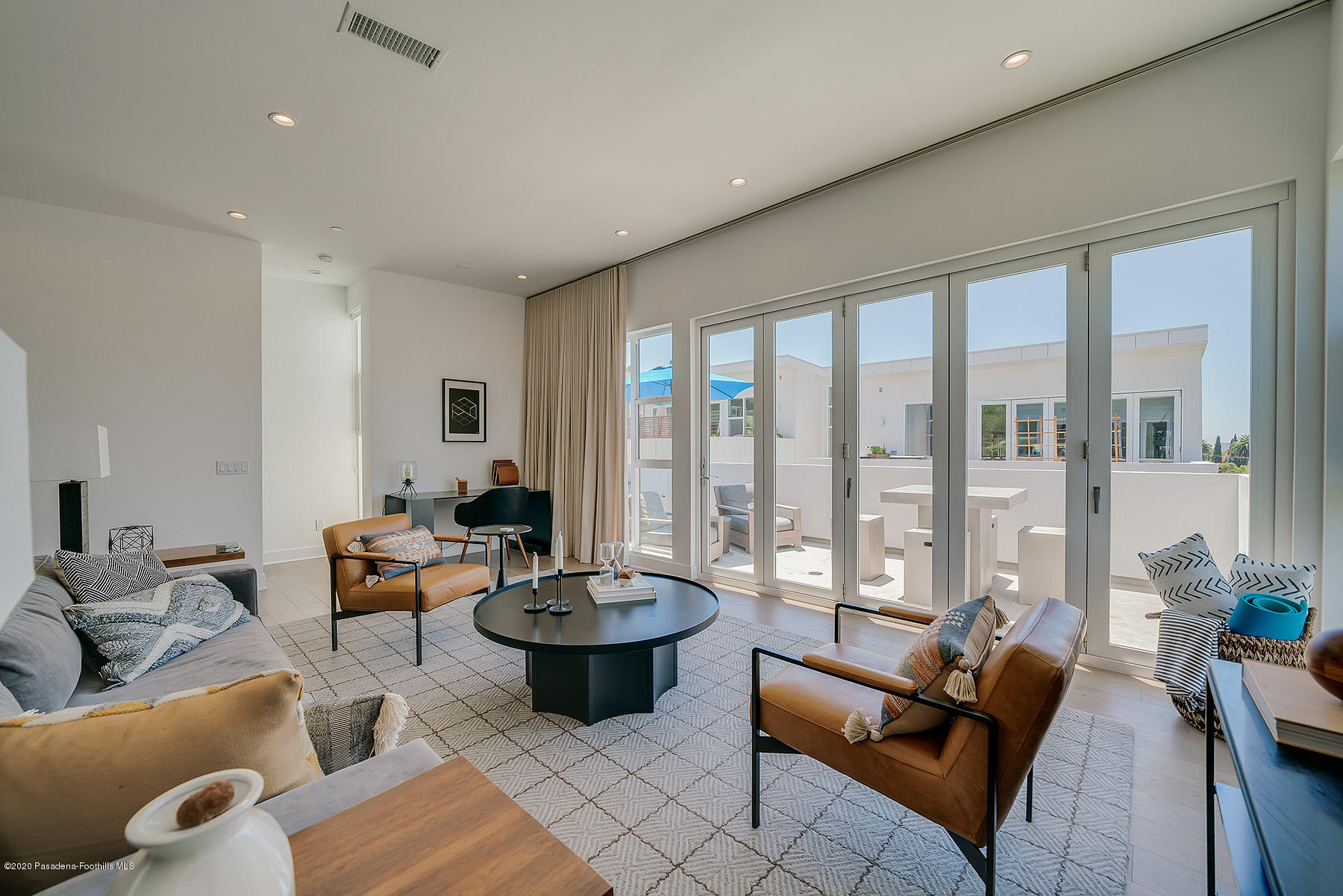 855 Hyperion Avenue Los Angeles, CA 90029 - Photo 3 of 35 a living room with furniture and a floor to ceiling window