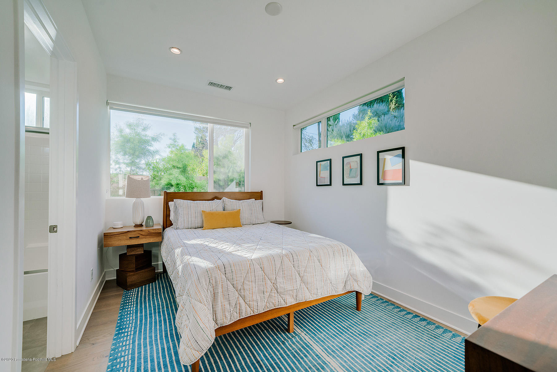 855 Hyperion Avenue Los Angeles, CA 90029 - Photo 22 of 35 a bedroom with a bed and a window