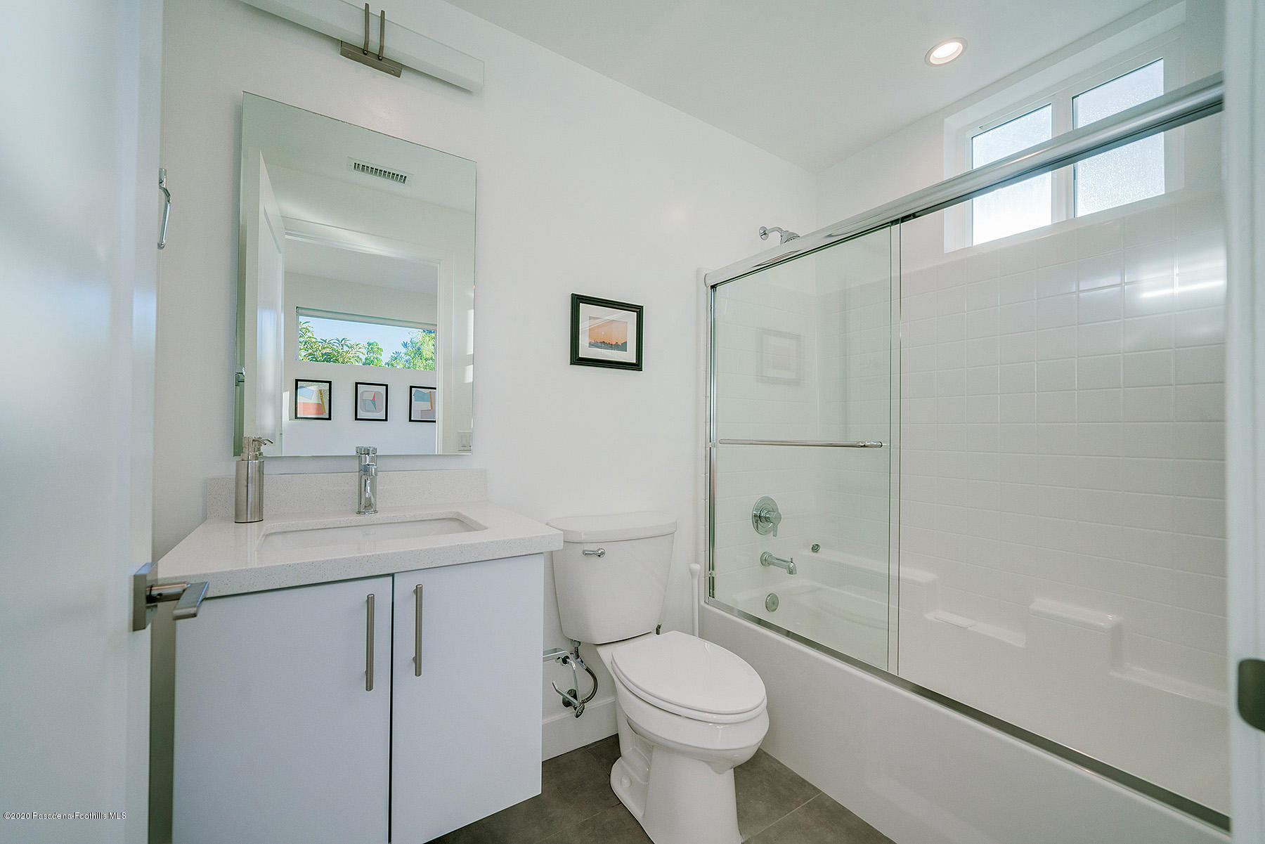 855 Hyperion Avenue Los Angeles, CA 90029 - Photo 24 of 35 a bathroom with a sink a toilet and shower