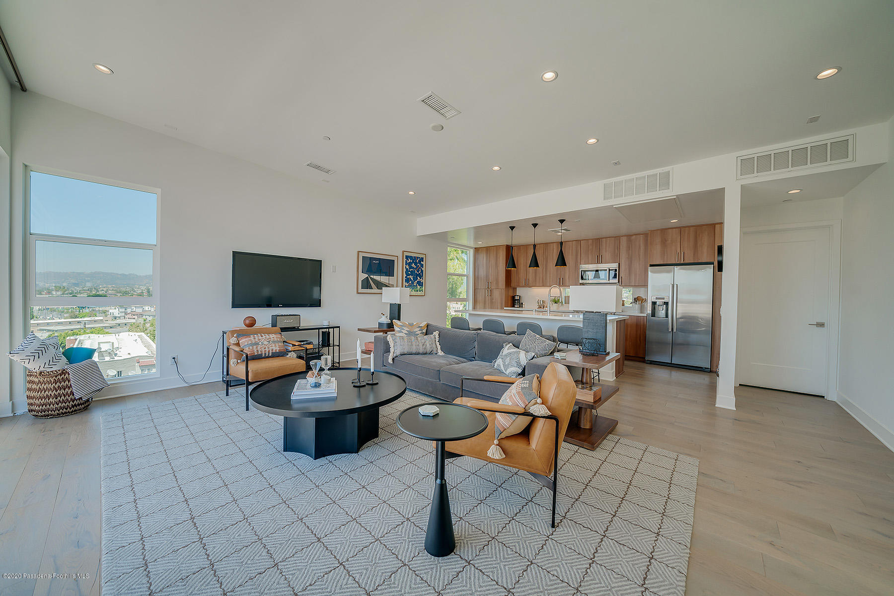 855 Hyperion Avenue Los Angeles, CA 90029 - Photo 4 of 35 a living room with furniture and a flat screen tv