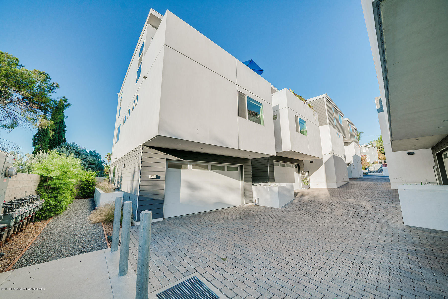 855 Hyperion Avenue Los Angeles, CA 90029 - Photo 31 of 35 a view of a white house with a yard