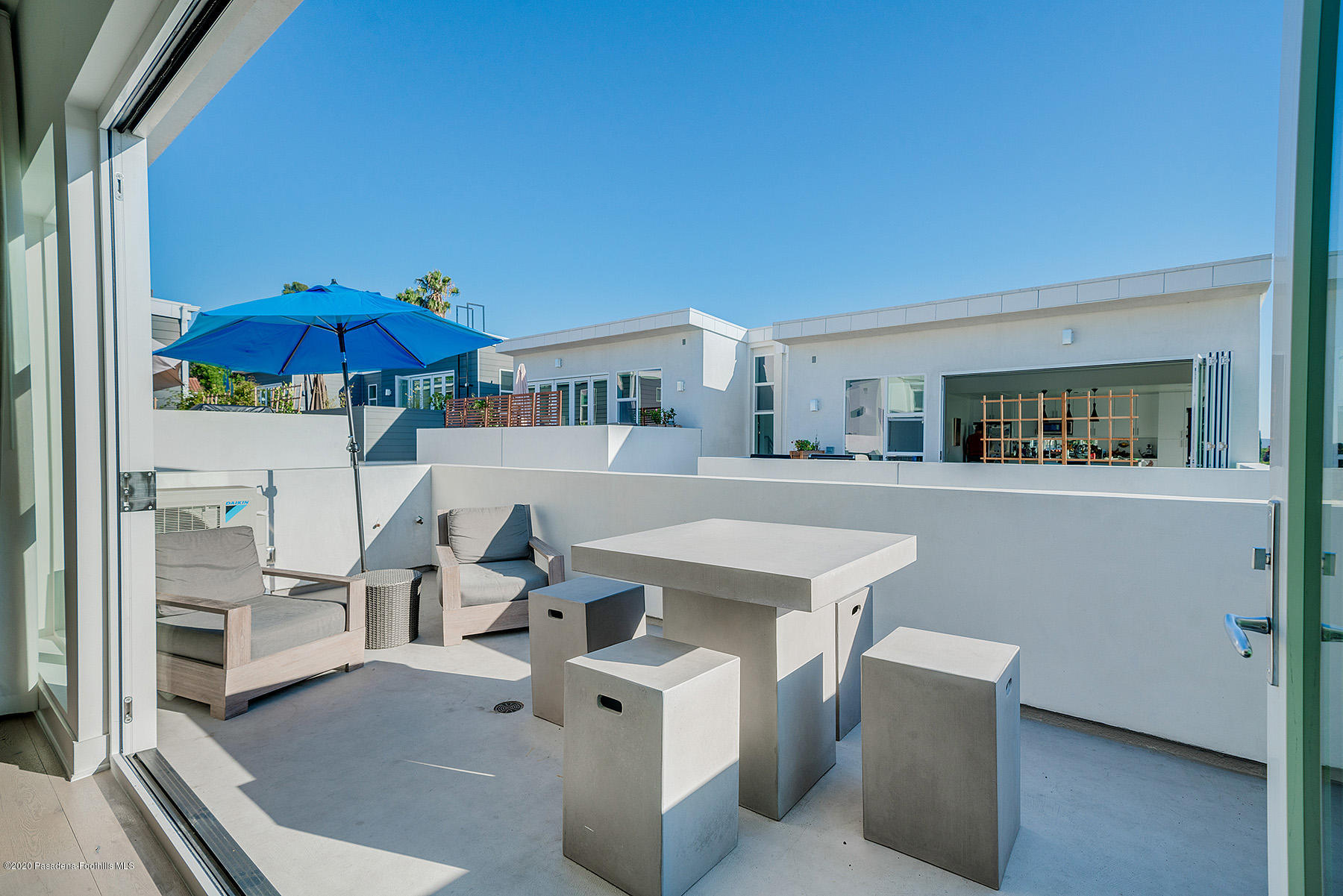 855 Hyperion Avenue Los Angeles, CA 90029 - Photo 7 of 35 a view of a kitchen with furniture and an umbrella