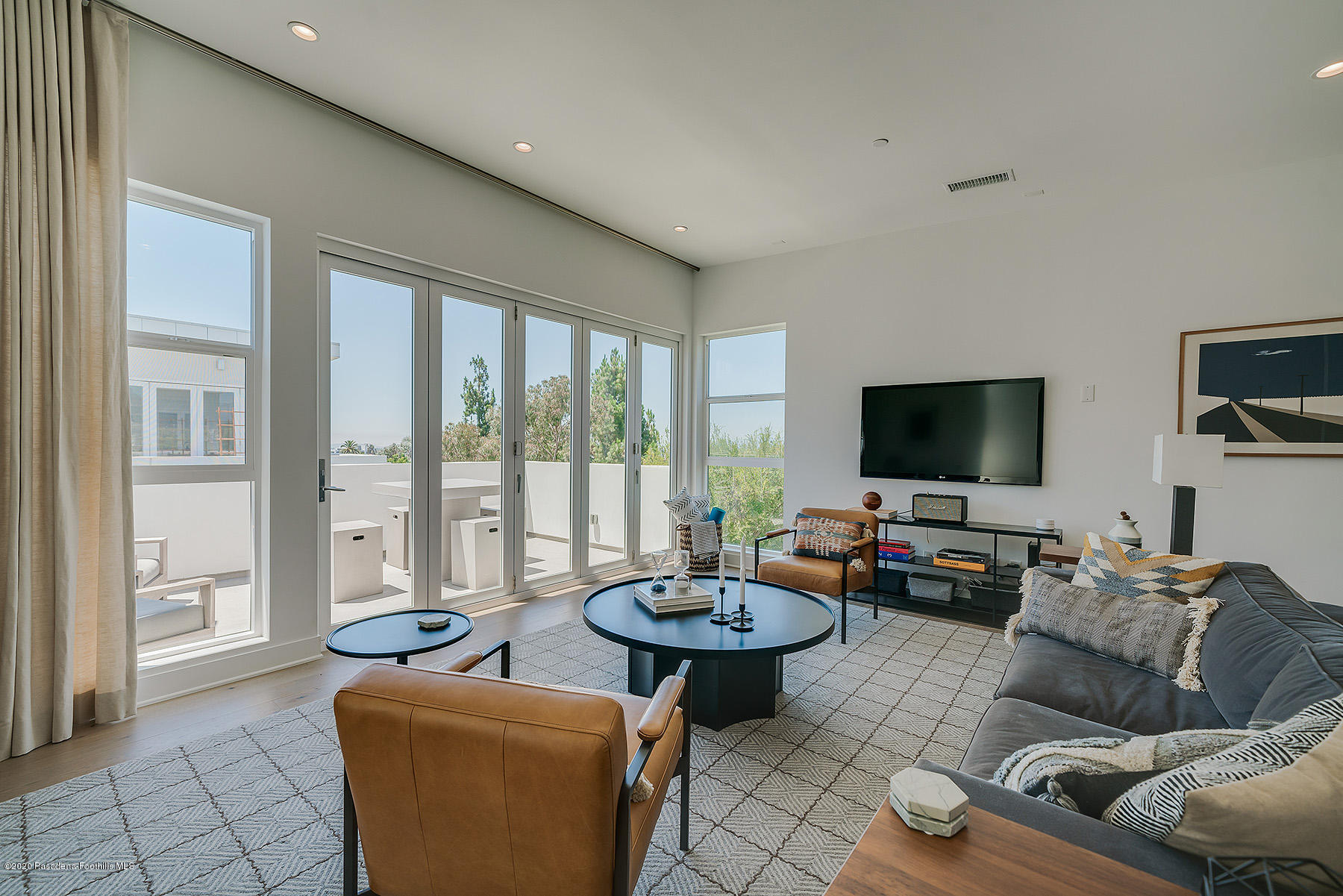 855 Hyperion Avenue Los Angeles, CA 90029 - Photo 10 of 35 a living room with furniture and a flat screen tv