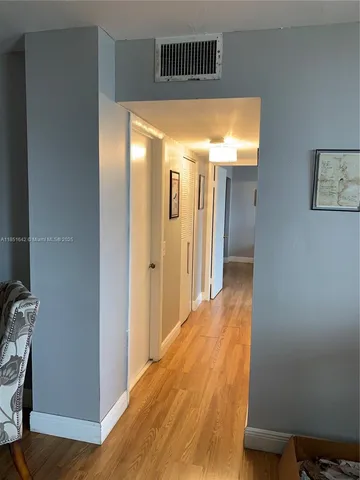 a view of hallway with livingroom