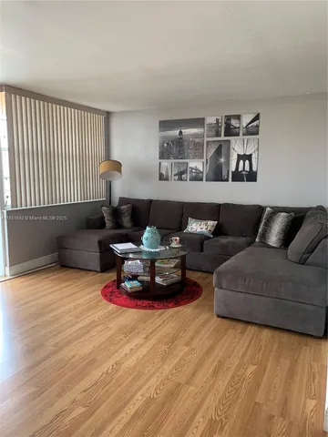 a living room with furniture and a window