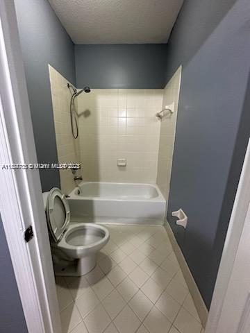 3390 Northeast 11th Drive, Unit 3390 Homestead, FL 33033 - Photo 13 of 20 a bathroom with a granite countertop sink toilet and shower