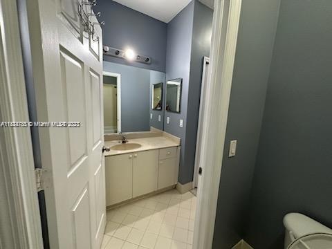 3390 Northeast 11th Drive, Unit 3390 Homestead, FL 33033 - Photo 16 of 20 a bathroom with a granite countertop sink a mirror and a shower