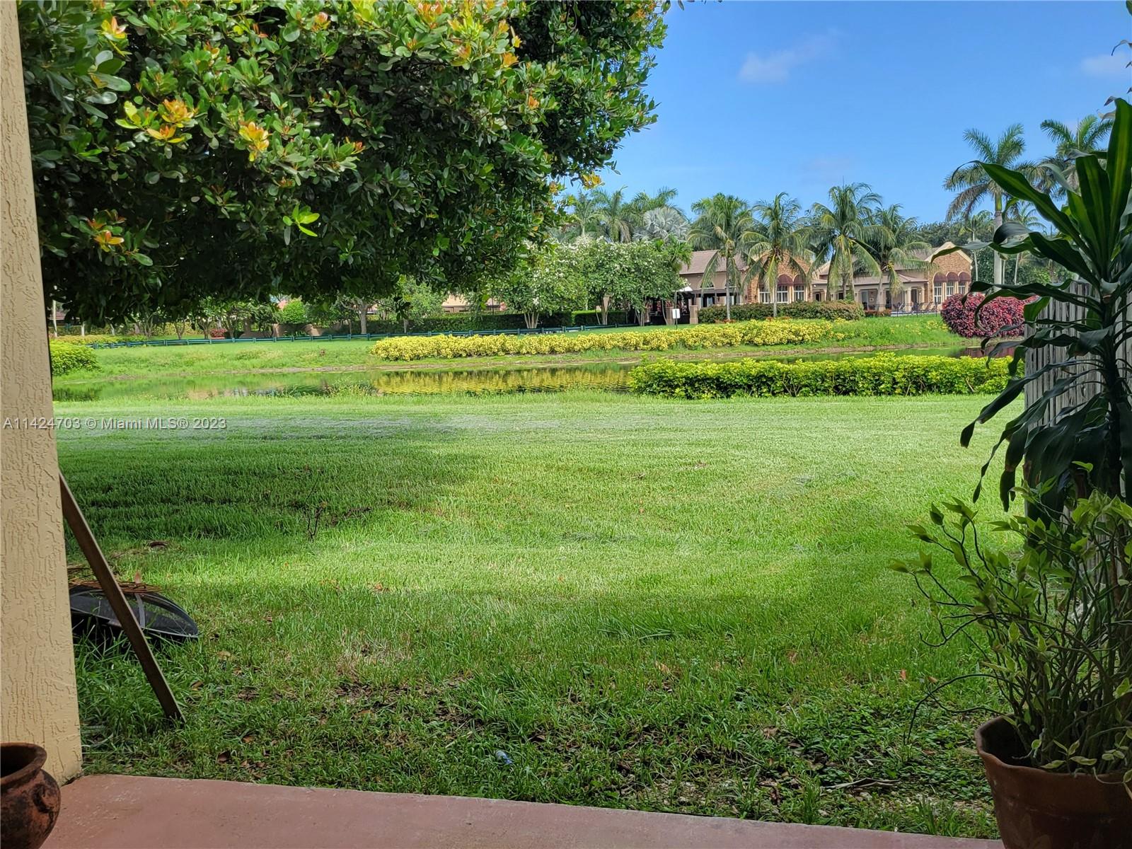 3390 Northeast 11th Drive, Unit 3390 Homestead, FL 33033 - Photo 19 of 20 a view of a garden with a lake