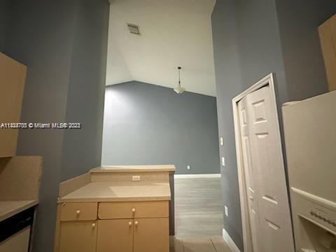 3390 Northeast 11th Drive, Unit 3390 Homestead, FL 33033 - Photo 9 of 20 a utility room with cabinets washer and dryer