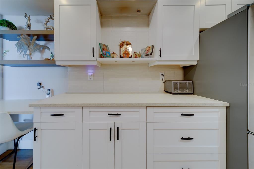 255 Dolphin Point, Unit 802 Clearwater Beach, FL 33767 - Photo 17 of 41 a view of white cabinets