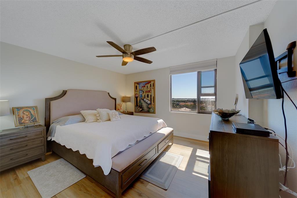 255 Dolphin Point, Unit 802 Clearwater Beach, FL 33767 - Photo 21 of 41 a bedroom with bed and window