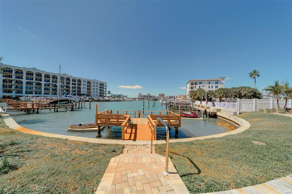 255 Dolphin Point, Unit 802 Clearwater Beach, FL 33767 - Photo 30 of 41 swimming pool view with a outdoor seating space