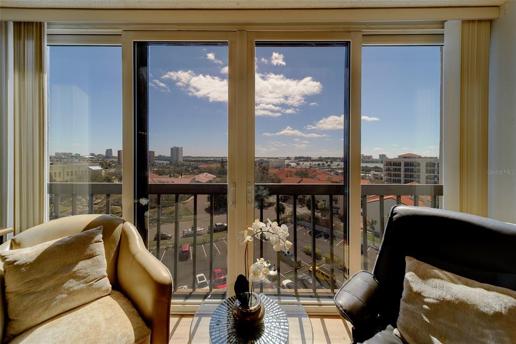 255 Dolphin Point, Unit 802 Clearwater Beach, FL 33767 - Photo 4 of 41 a view of a balcony with furniture