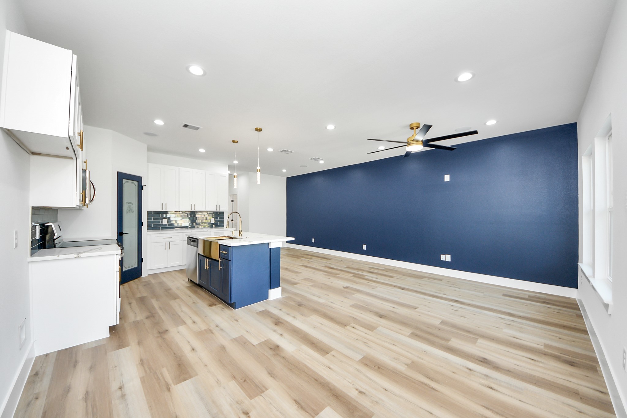 4606 Mallow Street Houston, TX 77051 - Photo 11 of 31 a kitchen with stainless steel appliances kitchen island a refrigerator sink and stove