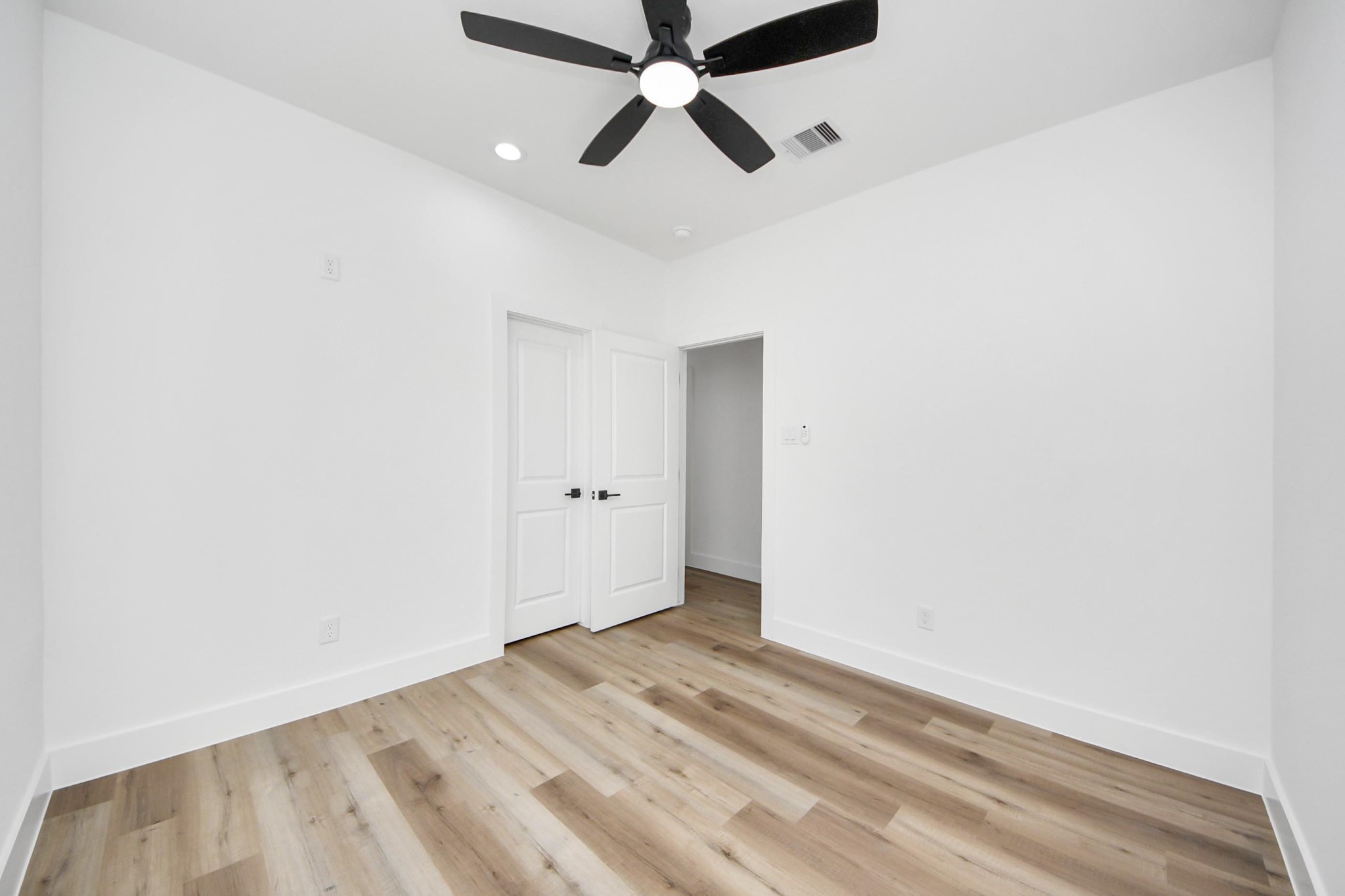 4606 Mallow Street Houston, TX 77051 - Photo 28 of 31 Secondary bedroom features a large window and ceiling fan.